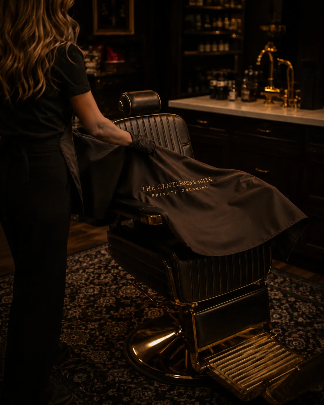 The chair made ready, a Gentlemen's Suite cape drawn over it